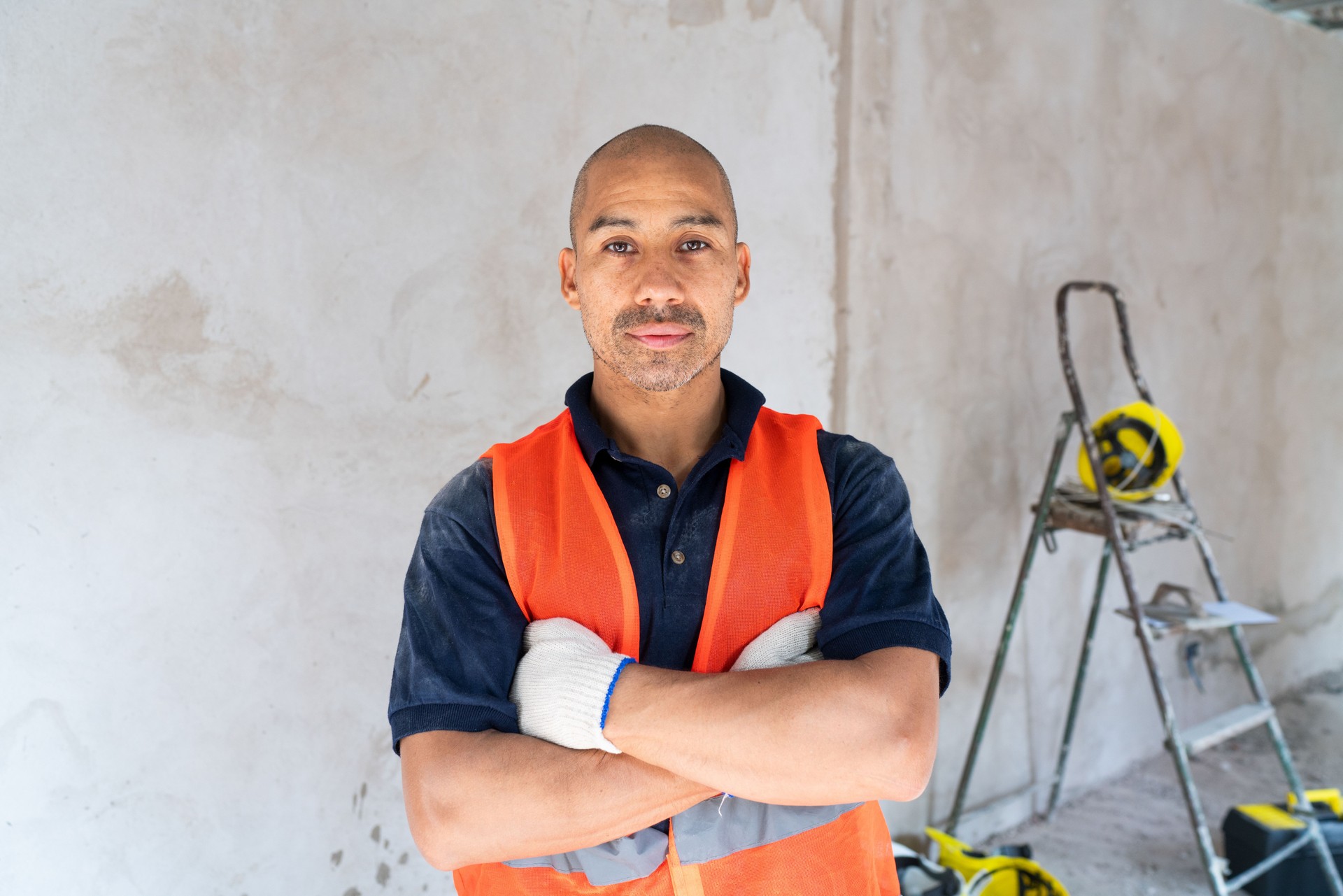 Confident Construction Worker at Renovation Site